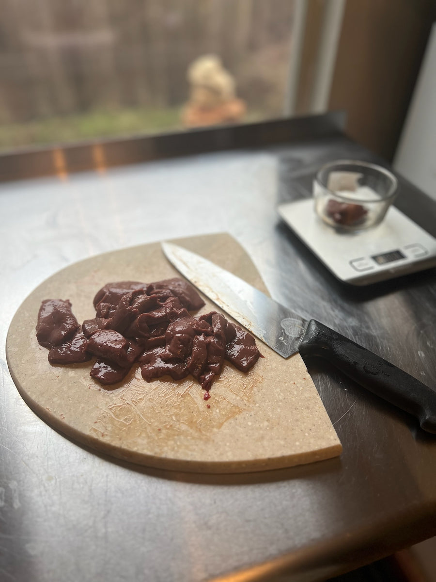 Beef being prepared on a cutting board